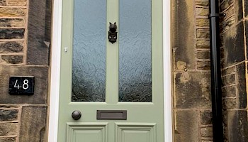 recently installed pistatio coloured solid door.